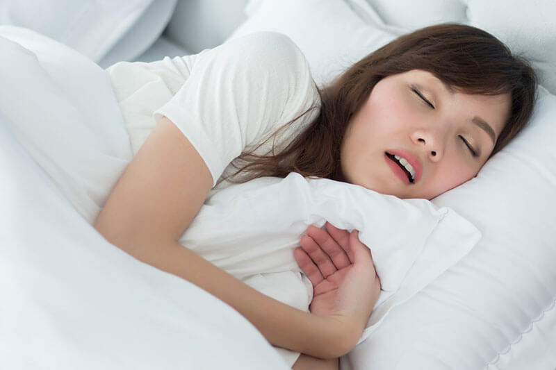 woman sleeping with mouth ooen